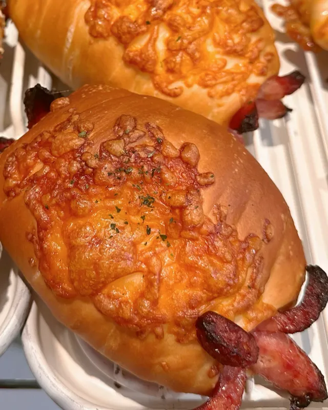 Sausage salt bread with golden melted cheese on top